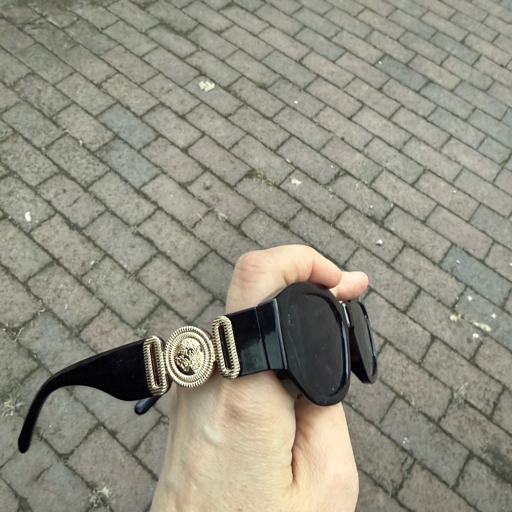 Black Sunglasses with Gold Medallion Accent